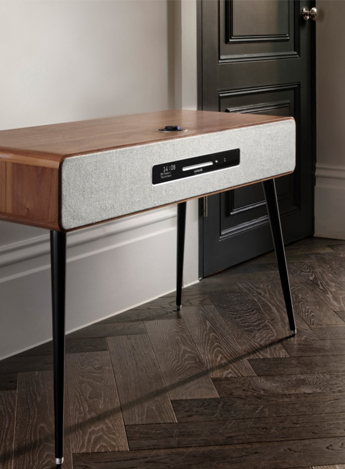 Ruark R7 Radiogram with stained wood finish on hardwood floor.